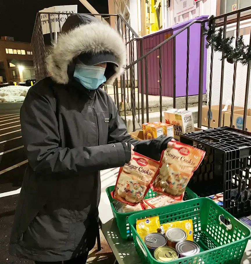 Women distributing food during covid